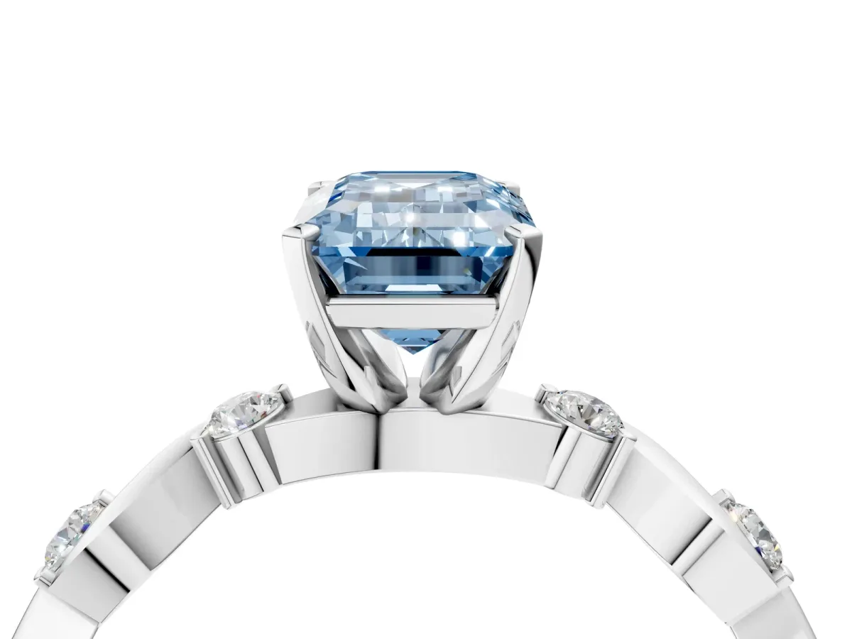 Fancy Blue Emerald Cut Diamond Solitaire Twisted Band with Round Accents and Prong Setting Silver