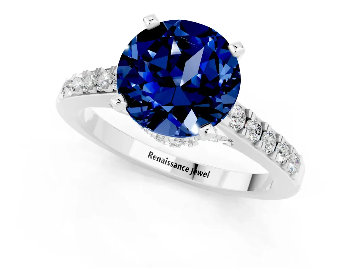 Round Cut Blue Sapphire Solitaire Ring with Crossover Gallery and Round Pavé Band Silver