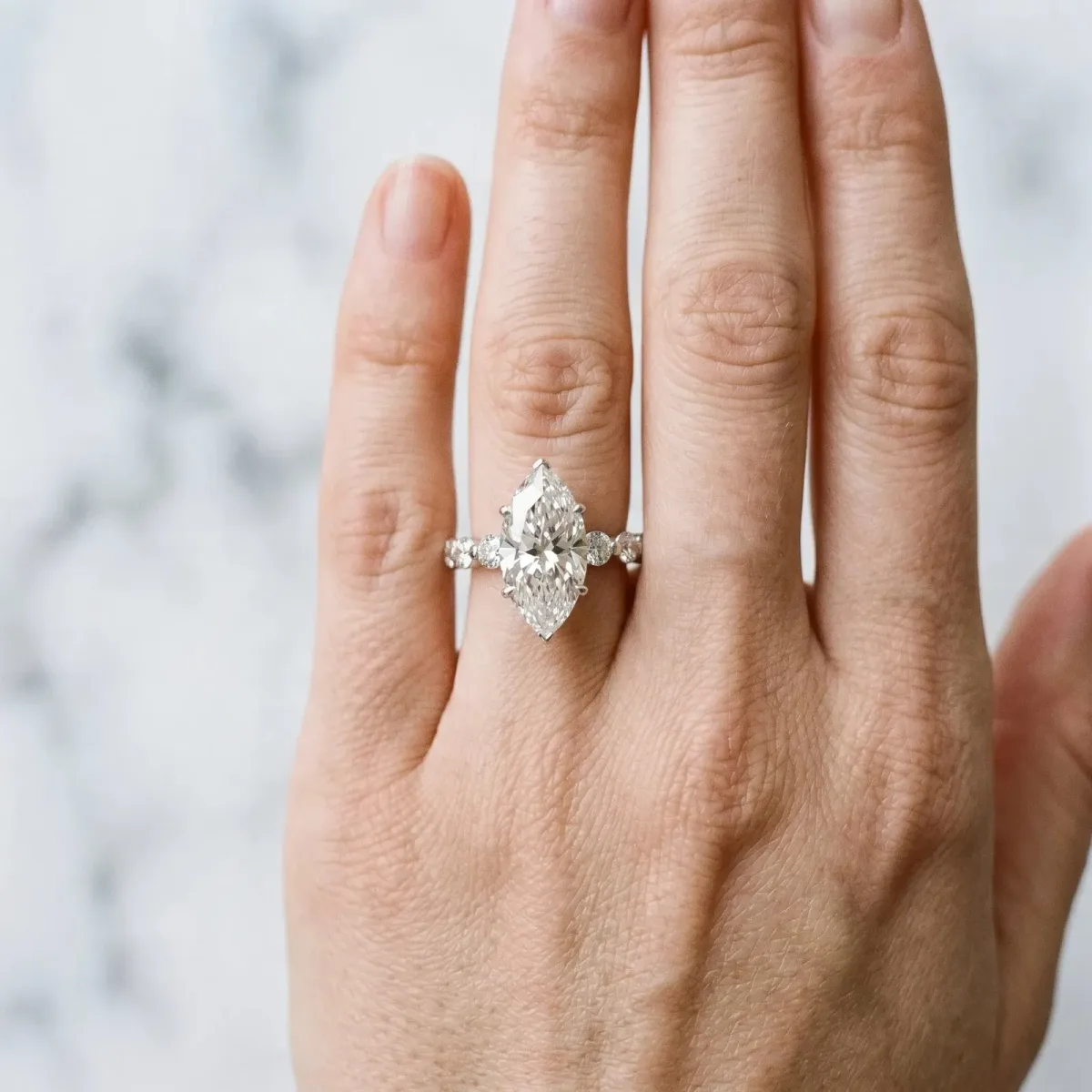 Marquise Cut Solitaire Diamond Ring with Pave Band and Four-Prong Setting Silver