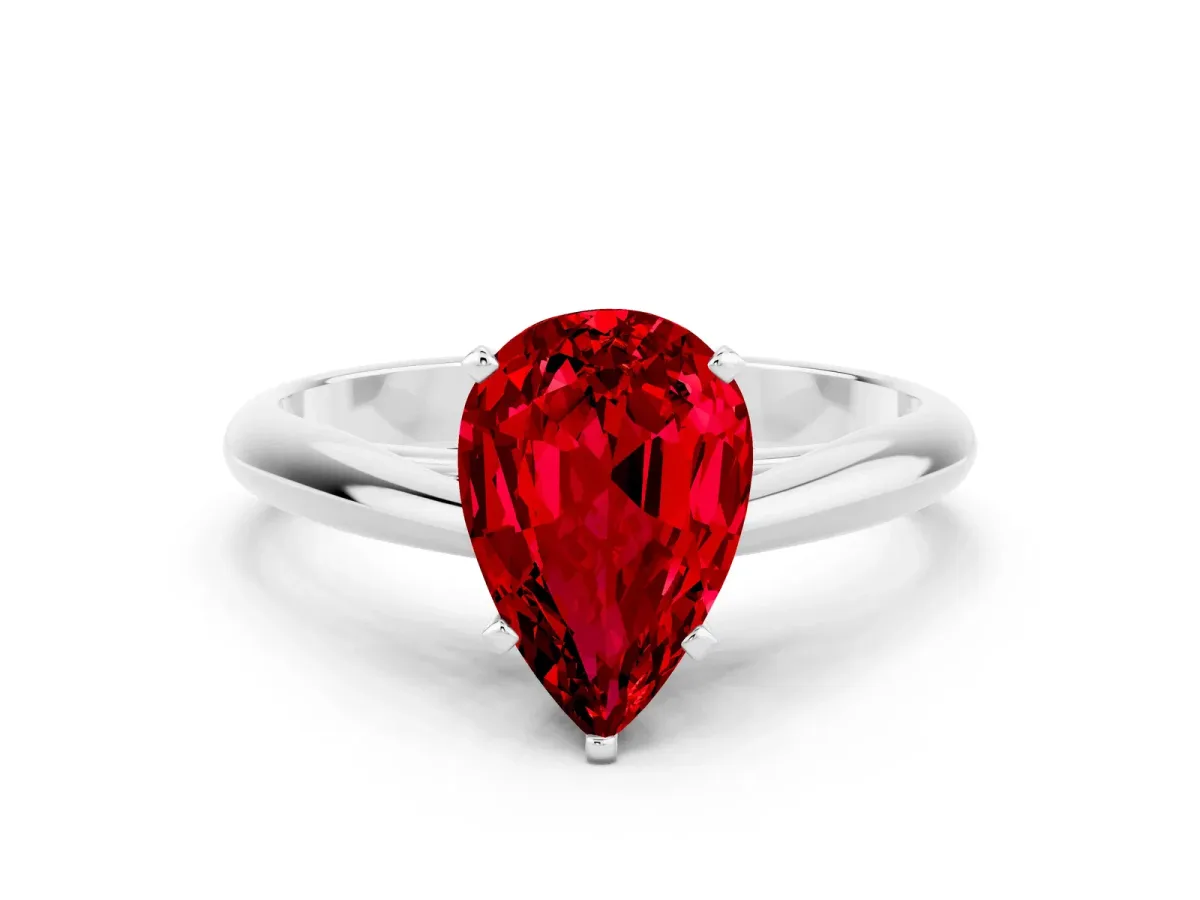 Pear Cut Ruby Solitaire Engagement Ring with Cathedral Setting and Four-Prong Mount White gold