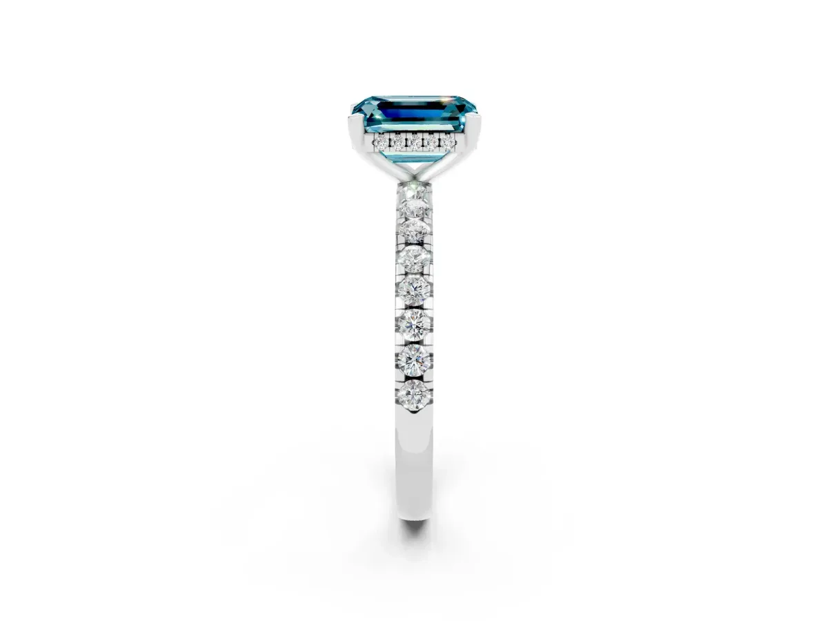 Emerald Cut Blue Topaz Solitaire Ring with Round Pavé Band and Four-Prong Setting Silver