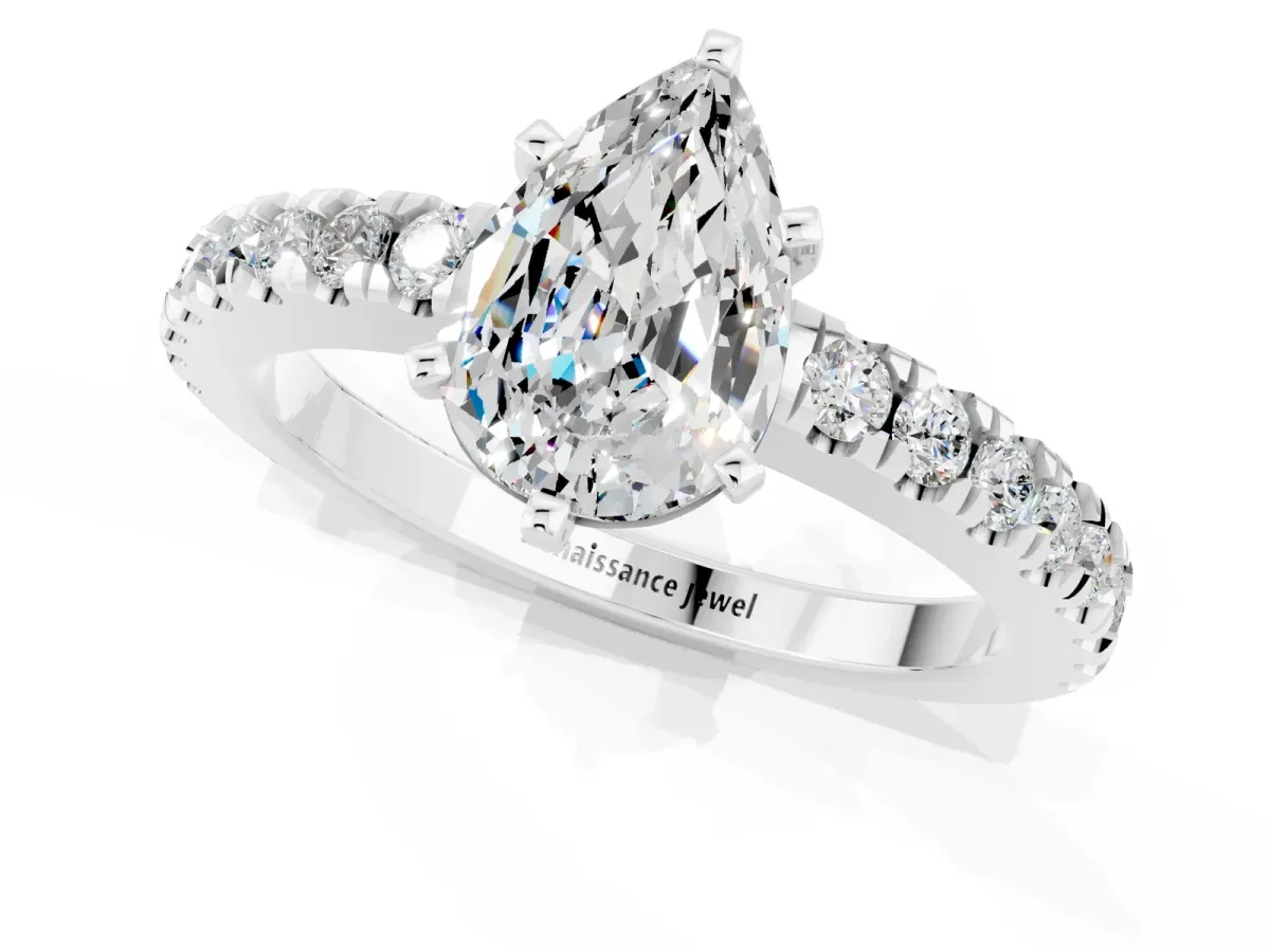 Pear Cut Solitaire Moissanite with Pavé Band and Four-Prong Setting Silver