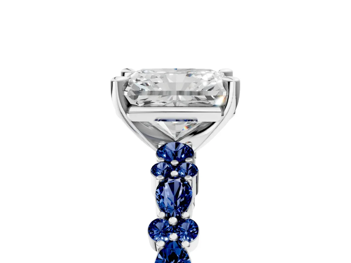 Radiant Cut Diamond Side Stone Solitaire Ring with Round Blue Sapphire and Four-Prong Setting Platinum