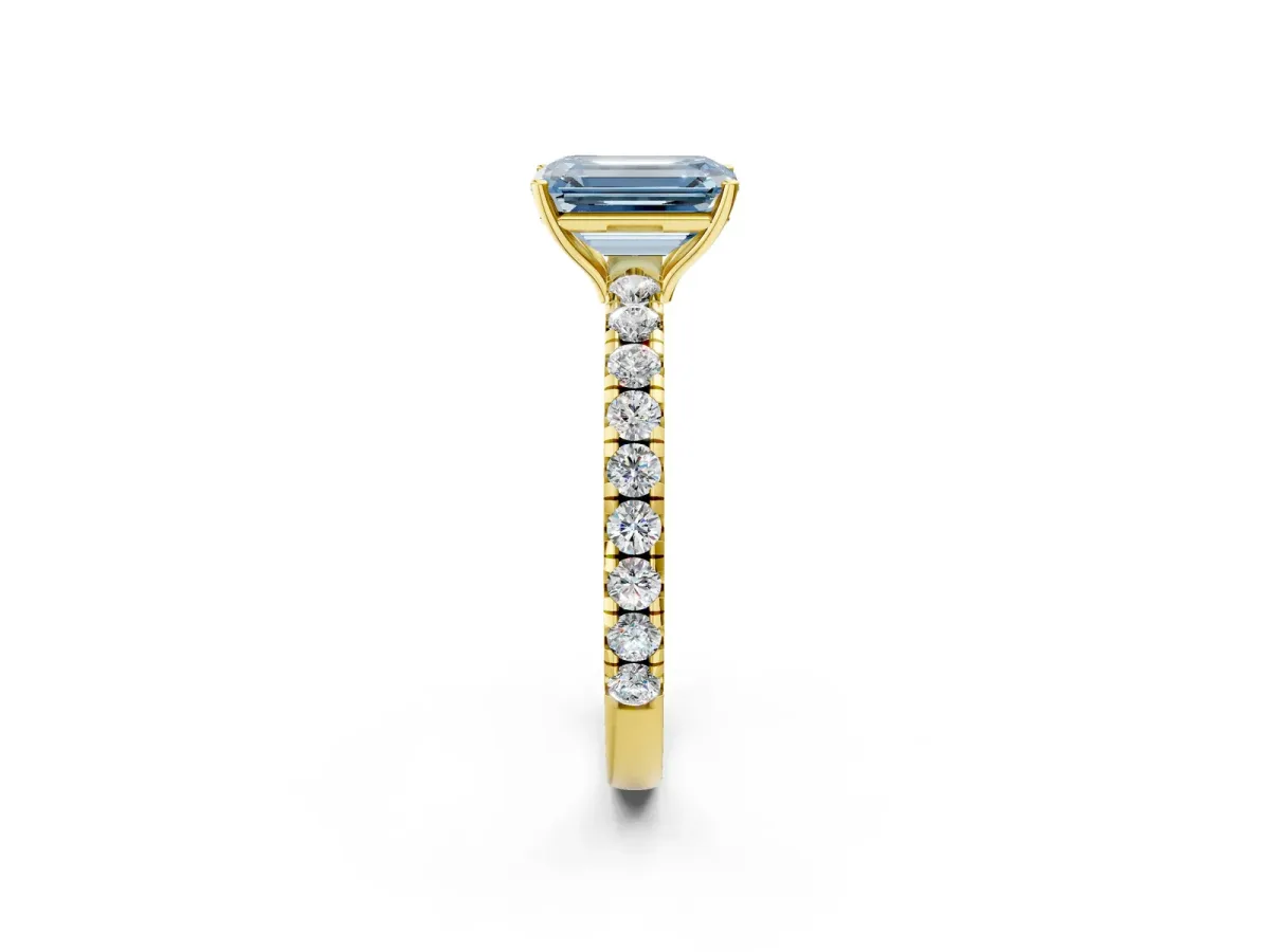Fancy Blue Emerald Cut Diamond Pavé Solitaire Engagement Ring with Four-Prong Setting Yellow gold