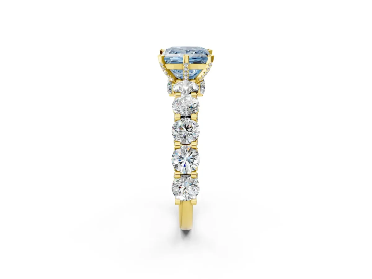 Fancy Blue Princess Cut Diamond Side Stone Engagement Ring with Four-Prong Setting Yellow gold