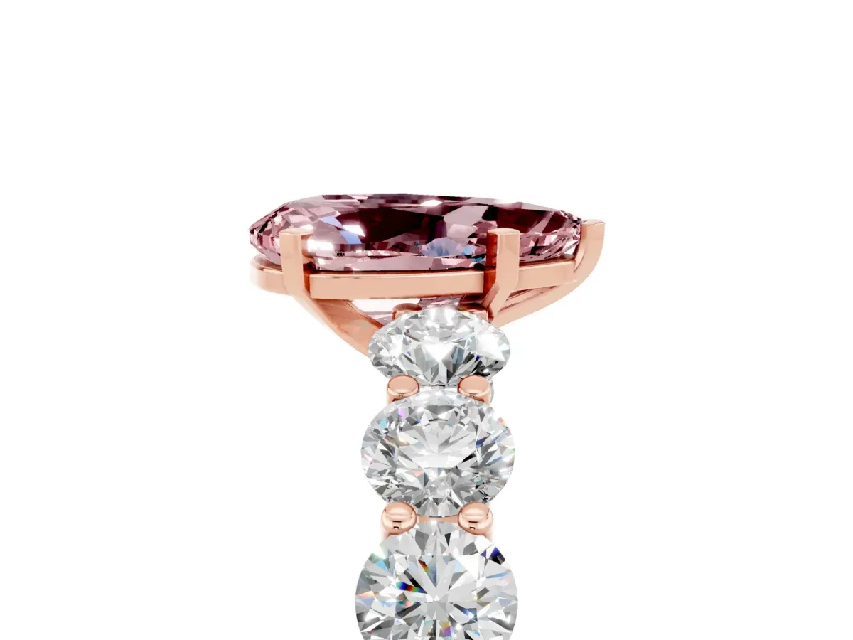 Pear Cut Morganite Prong Setting with Side Stones on a Pave Band Rose gold