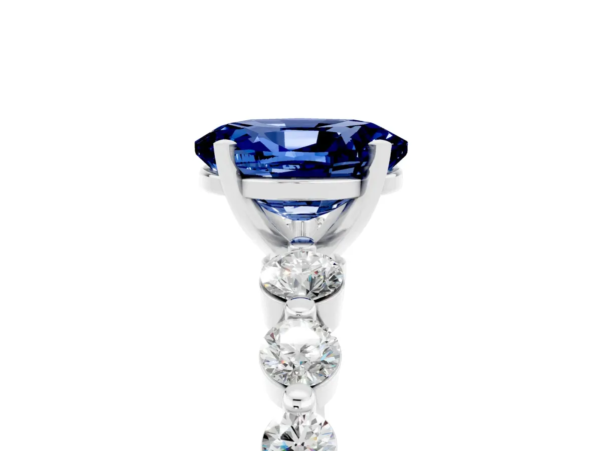 Oval Cut Solitaire Blue Sapphire Ring with Pave Band and Four-Prong Setting Silver