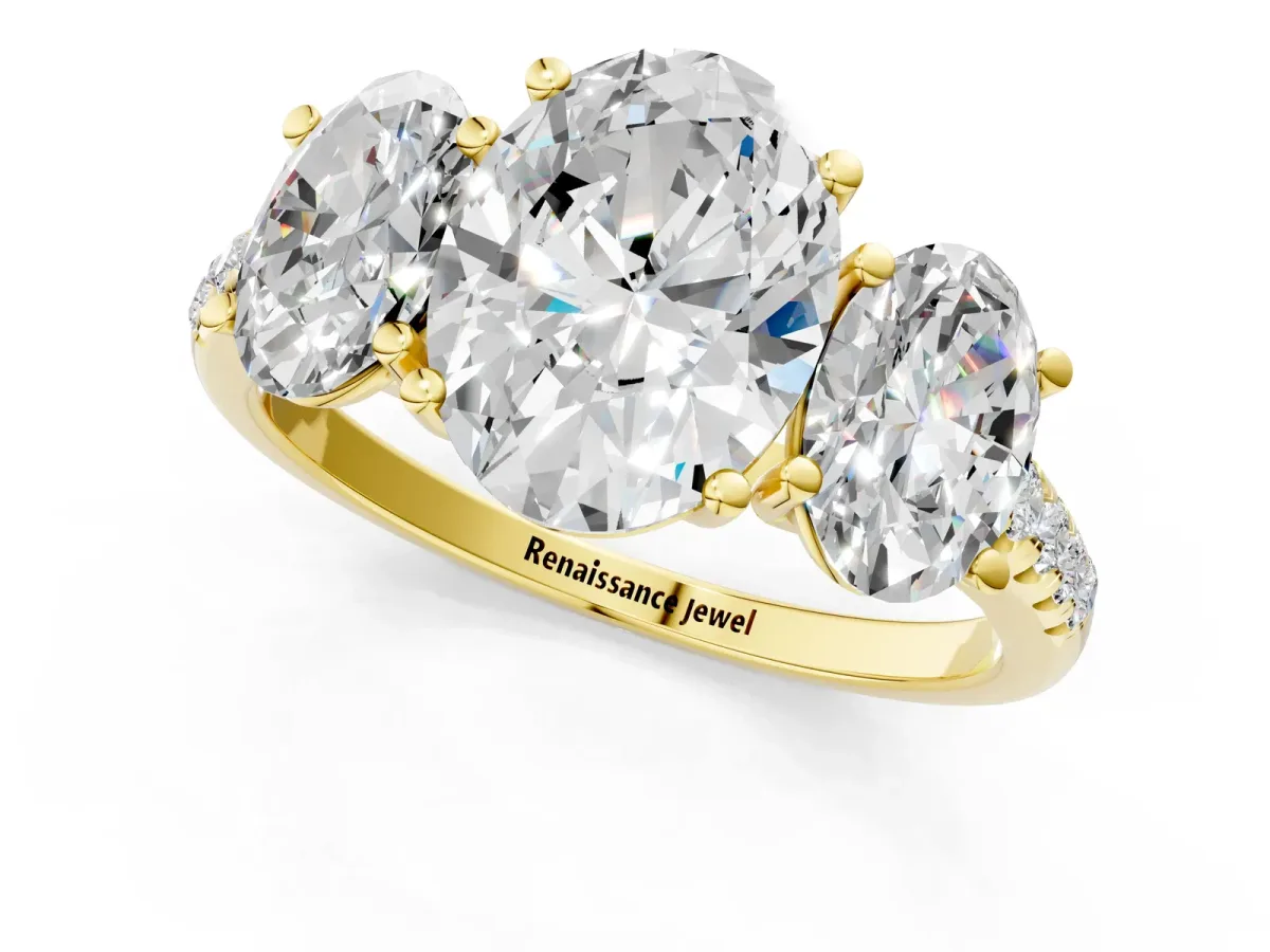 Three-Stone Oval Cut Diamond Ring with Round Pavé Band and Prong Setting Yellow gold