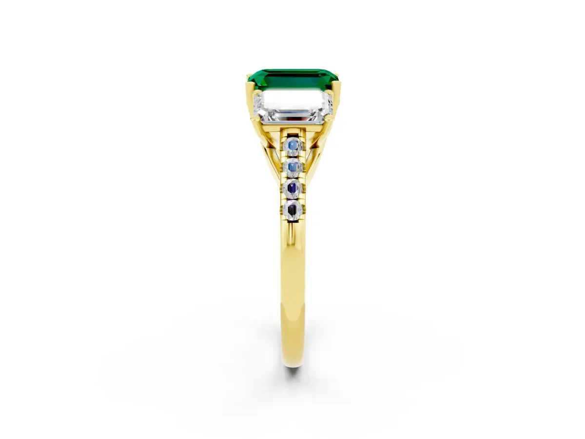 Three-Stone Emerald Cut Emerald Ring with Round Pavé Band and Prong Setting Yellow gold