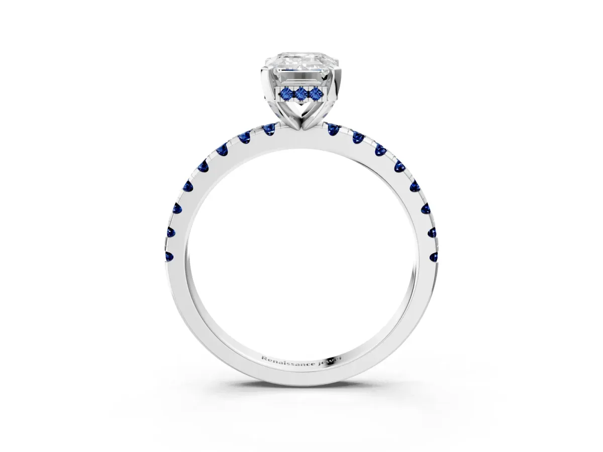 Emerald Cut Diamond Solitaire Ring with Round Blue Sapphire Pavé Band and Four-Prong Setting Silver