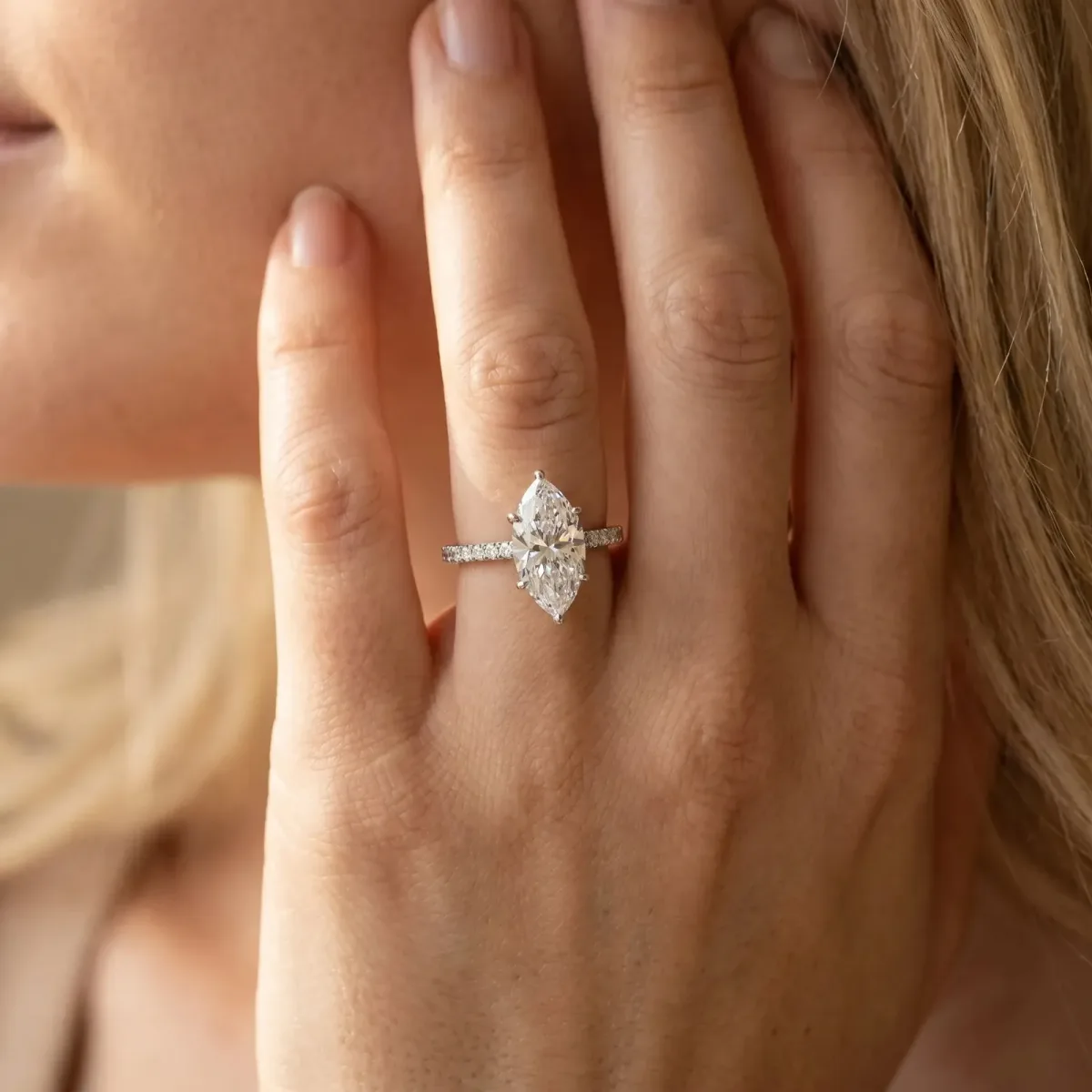 Marquise Cut Diamond Solitaire Ring with Round Pavé Shoulders and Prong Setting White gold