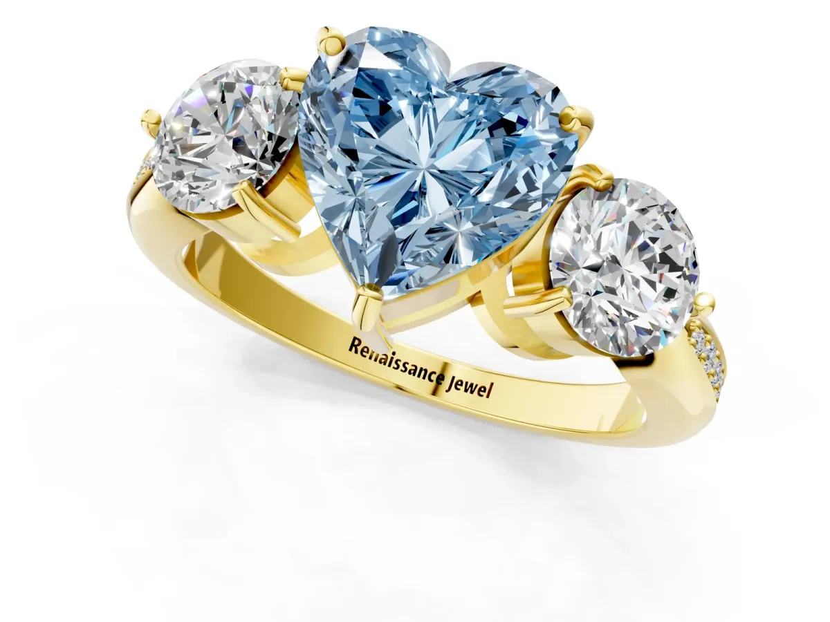 Fancy Blue Three-Stone Heart Cut Diamond Channel Set Engagement Ring with Prong Setting Yellow gold