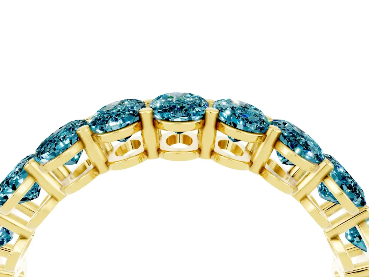 Oval Cut Blue Topaz Eternity Band with Shared Prong Setting Yellow gold