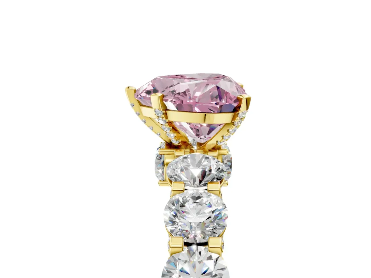 Fancy Pink Heart Cut Diamond Side Stone Engagement Ring with Four-Prong Setting Yellow gold