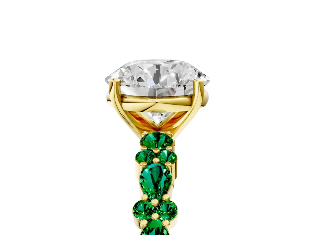 Round Cut Diamond Side Stone Solitaire Ring with Round Emerald and Four-Prong Setting Yellow gold