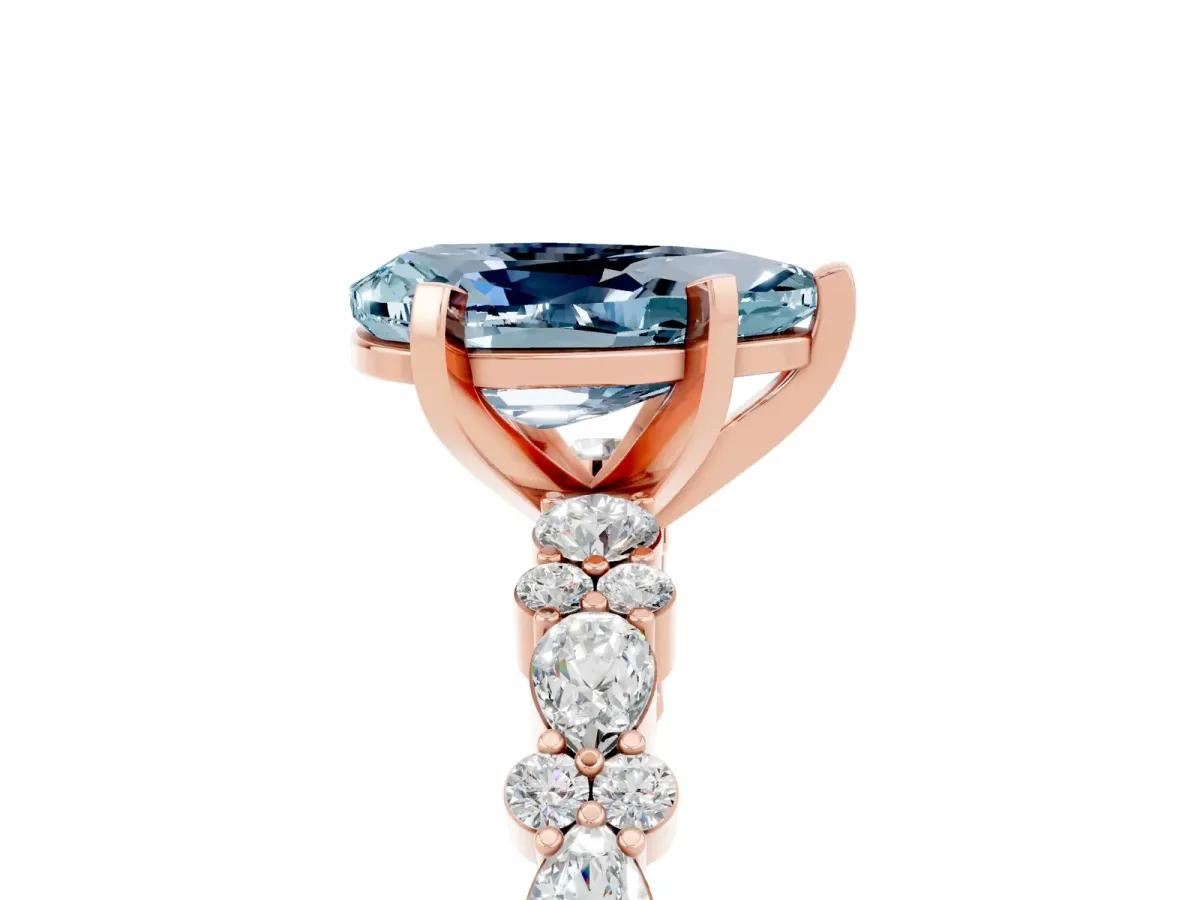 Pear Cut Aquamarine Side Stone Solitaire Ring with Round and Four-Prong Setting Rose gold