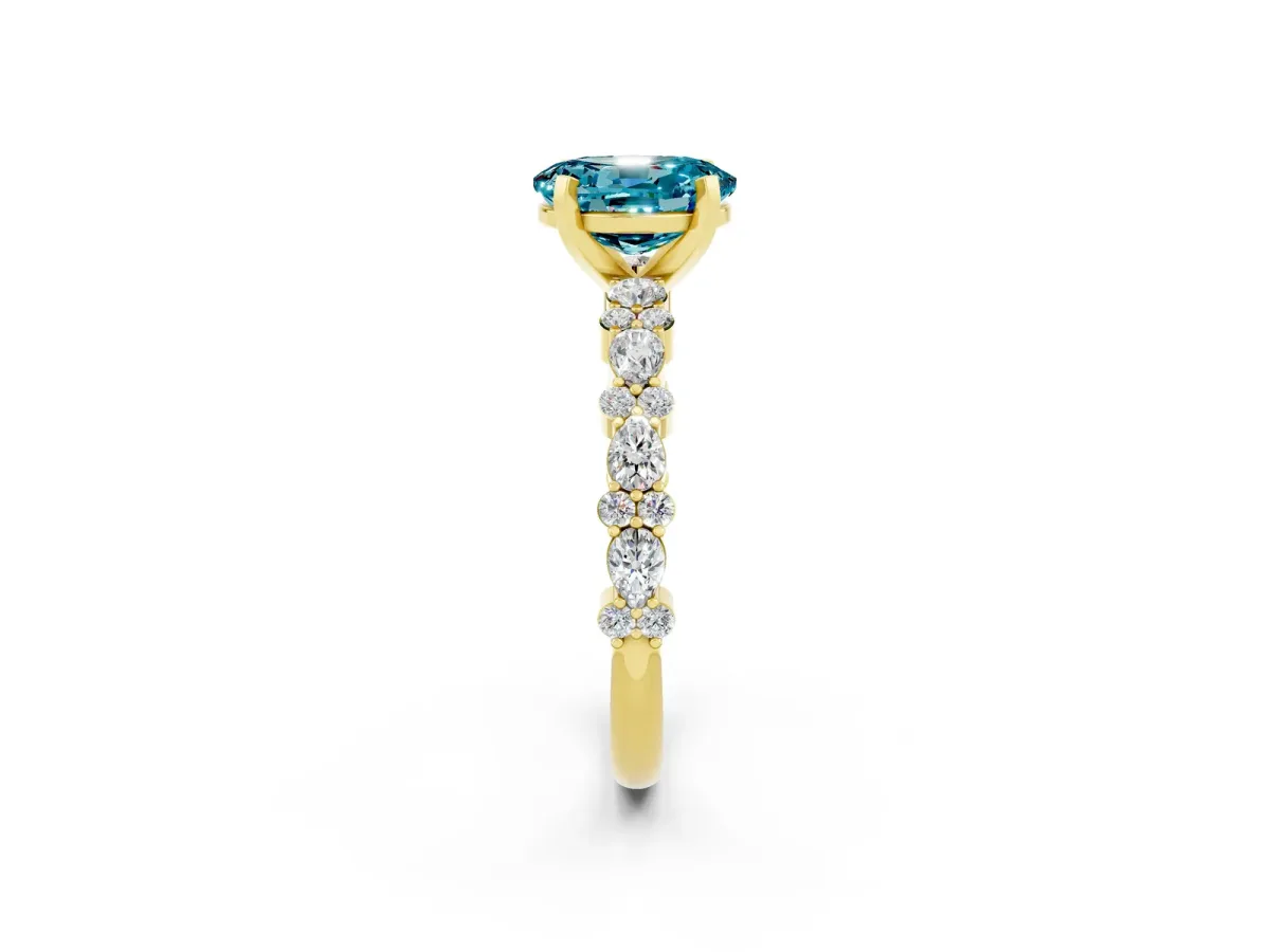 Oval Cut Blue Topaz Side Stone Solitaire Ring with Round and Four-Prong Setting Yellow gold
