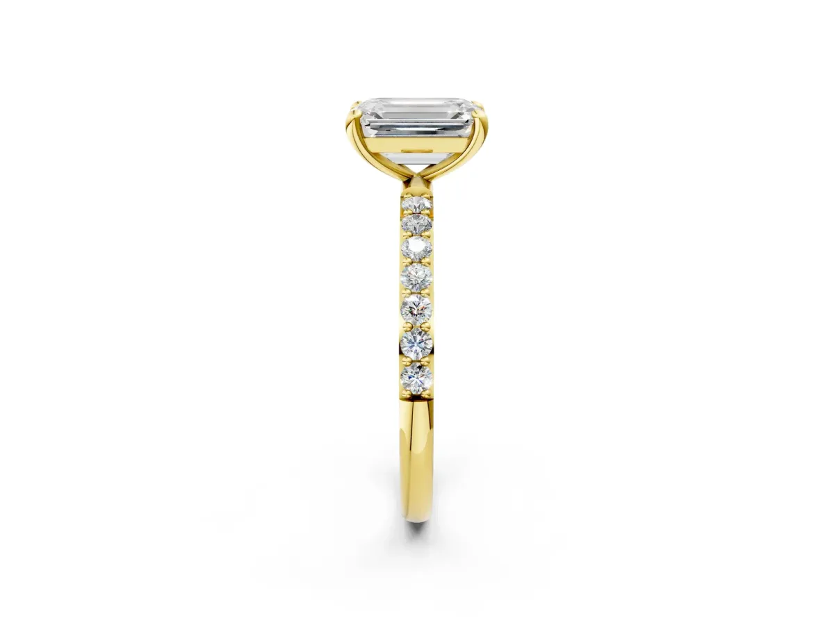 Emerald Cut Diamond Solitaire Ring with Round Pavé Band and Prong Setting Yellow gold