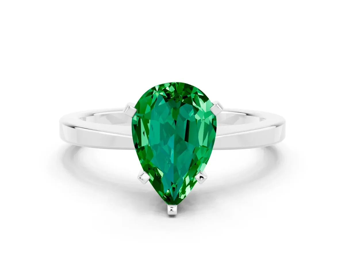 Pear Cut Emerald Solitaire Engagement Ring with Classic Band and Four-Prong Setting Silver