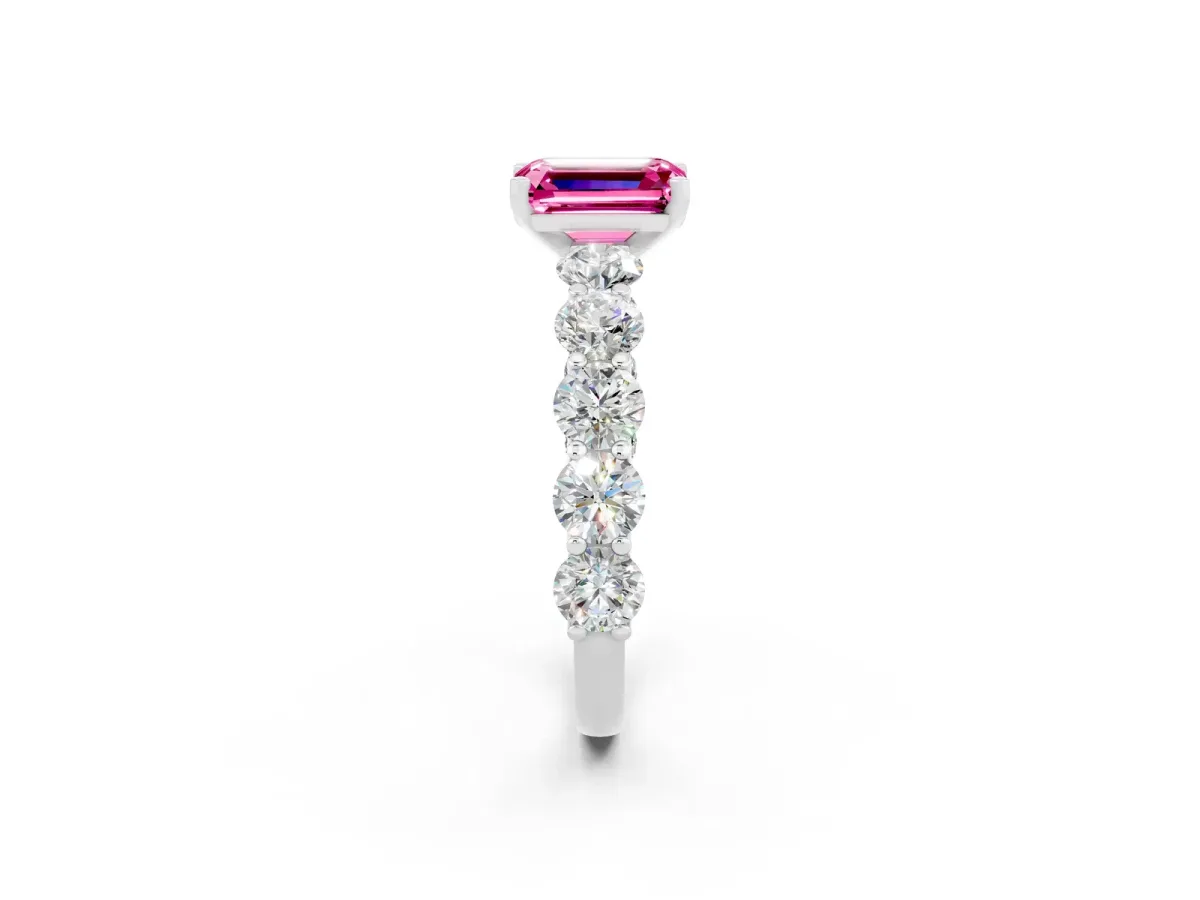 Emerald Cut Pink Sapphire Prong Setting with Side Stones on a Pave Band Silver