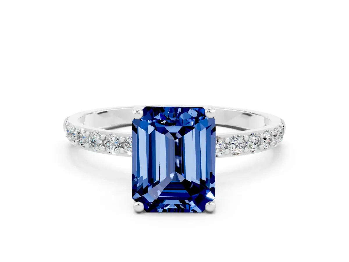 Emerald Cut Blue Sapphire Solitaire Ring with Round Pavé Band and Prong Setting Silver