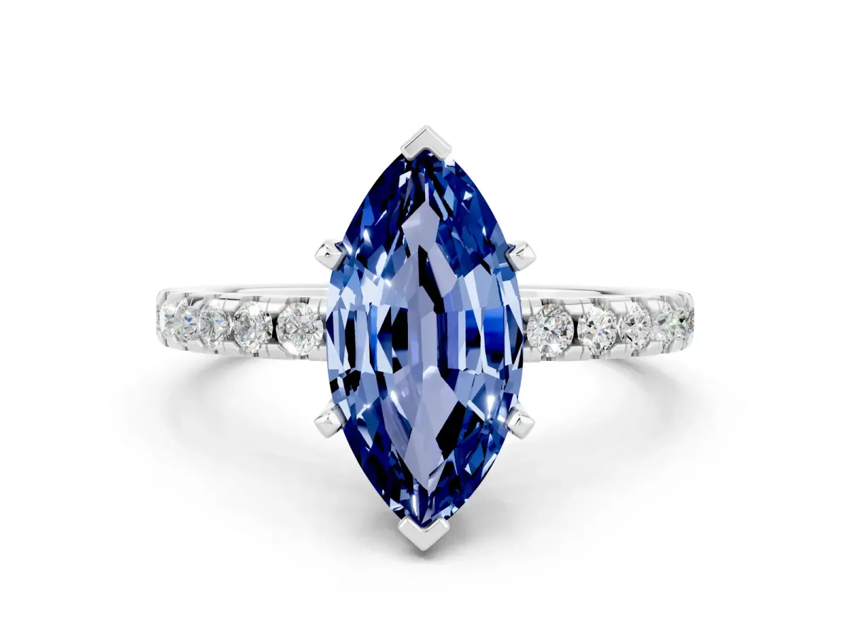 Marquise Cut Blue Sapphire Solitaire Ring with Round Pavé Band and Four-Prong Setting Silver