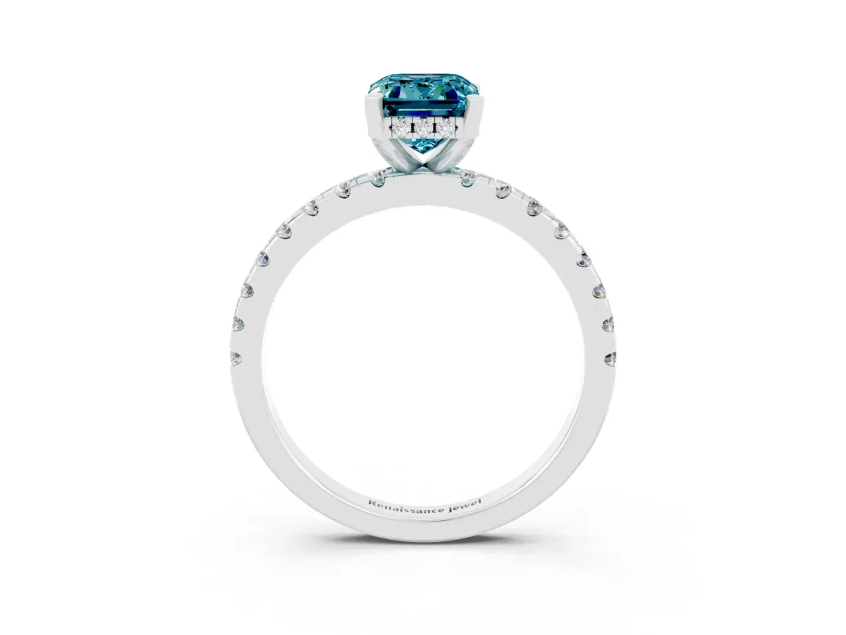 Emerald Cut Blue Topaz Solitaire Ring with Round Pavé Band and Four-Prong Setting Silver