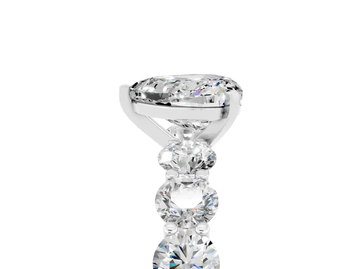 Heart Cut Moissanite Prong Setting with Side Stones on a Pave Band Silver