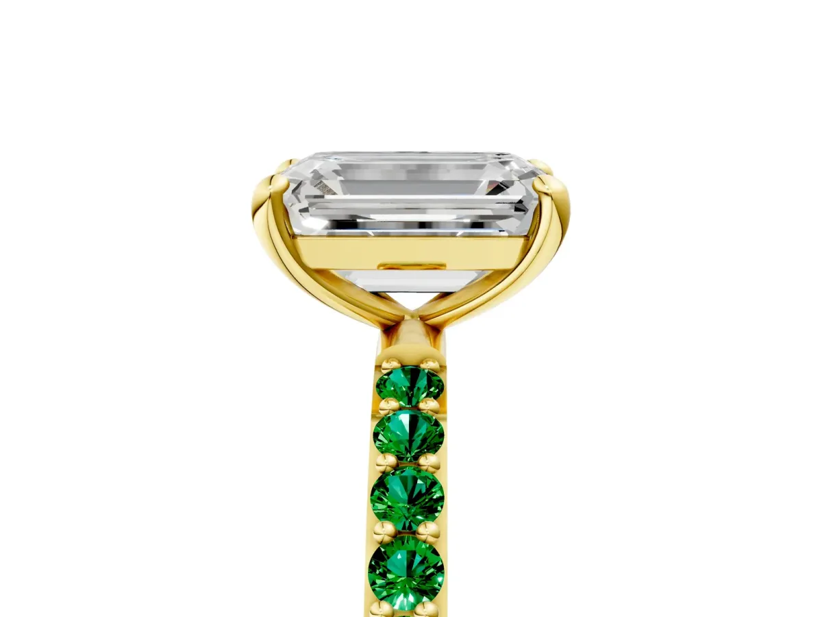 Emerald Cut Diamond Solitaire Ring with Round Emerald Pavé Band and Prong Setting Yellow gold