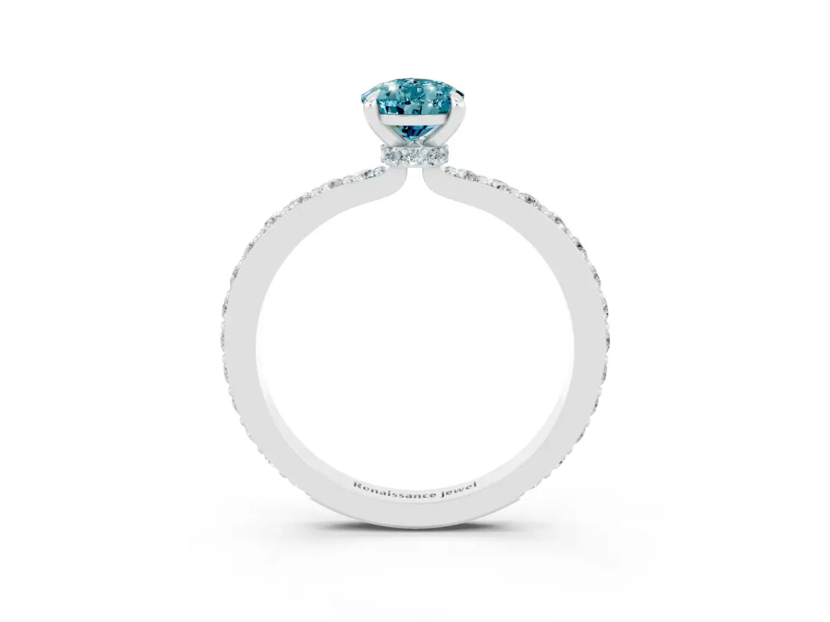 Pear Cut Blue Topaz Solitaire Engagement Ring with Pavé Band and Four-Prong Setting Silver