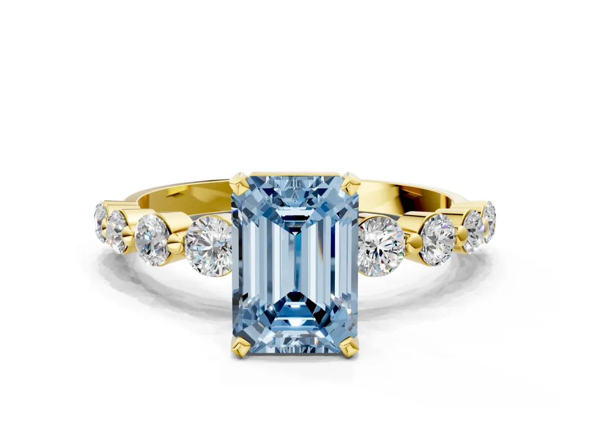 Fancy Blue Emerald Cut Solitaire Diamond Ring with Pave Band and Four-Prong Setting Yellow gold