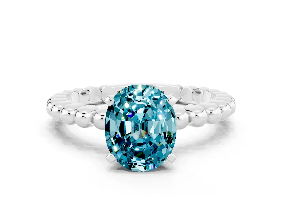Oval Cut Blue Topaz Solitaire Ring with Beaded Band and Prong Setting Silver
