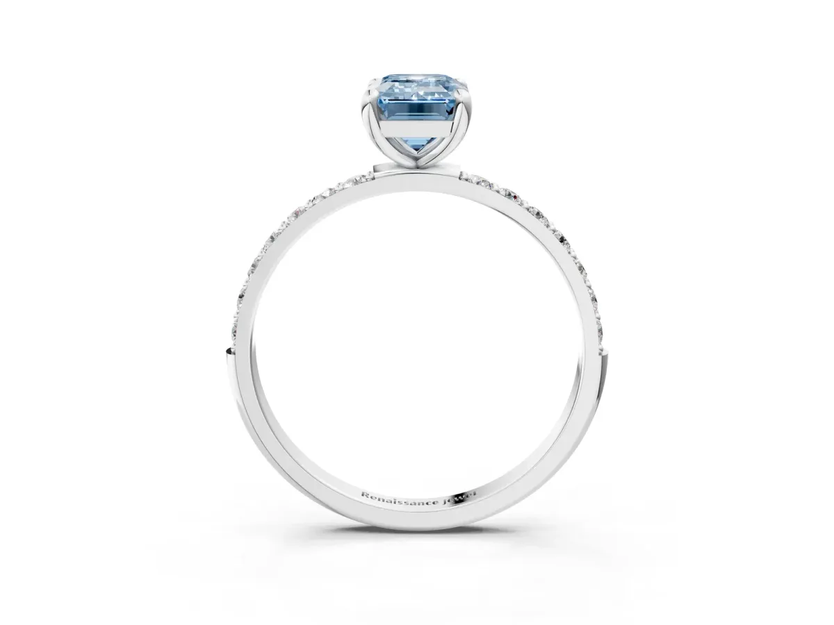 Fancy Blue Emerald Cut Diamond Solitaire Ring with Round Pavé Band and Prong Setting Platinum