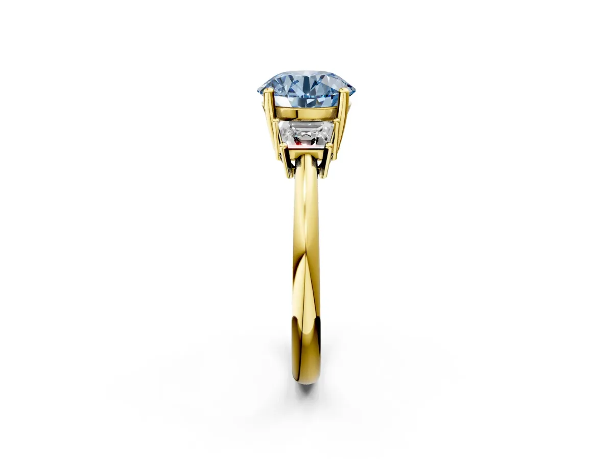 Fancy Blue Round Cut Diamond Three-Stone Ring with Trapezoid Side Stones and Prong Setting Yellow gold