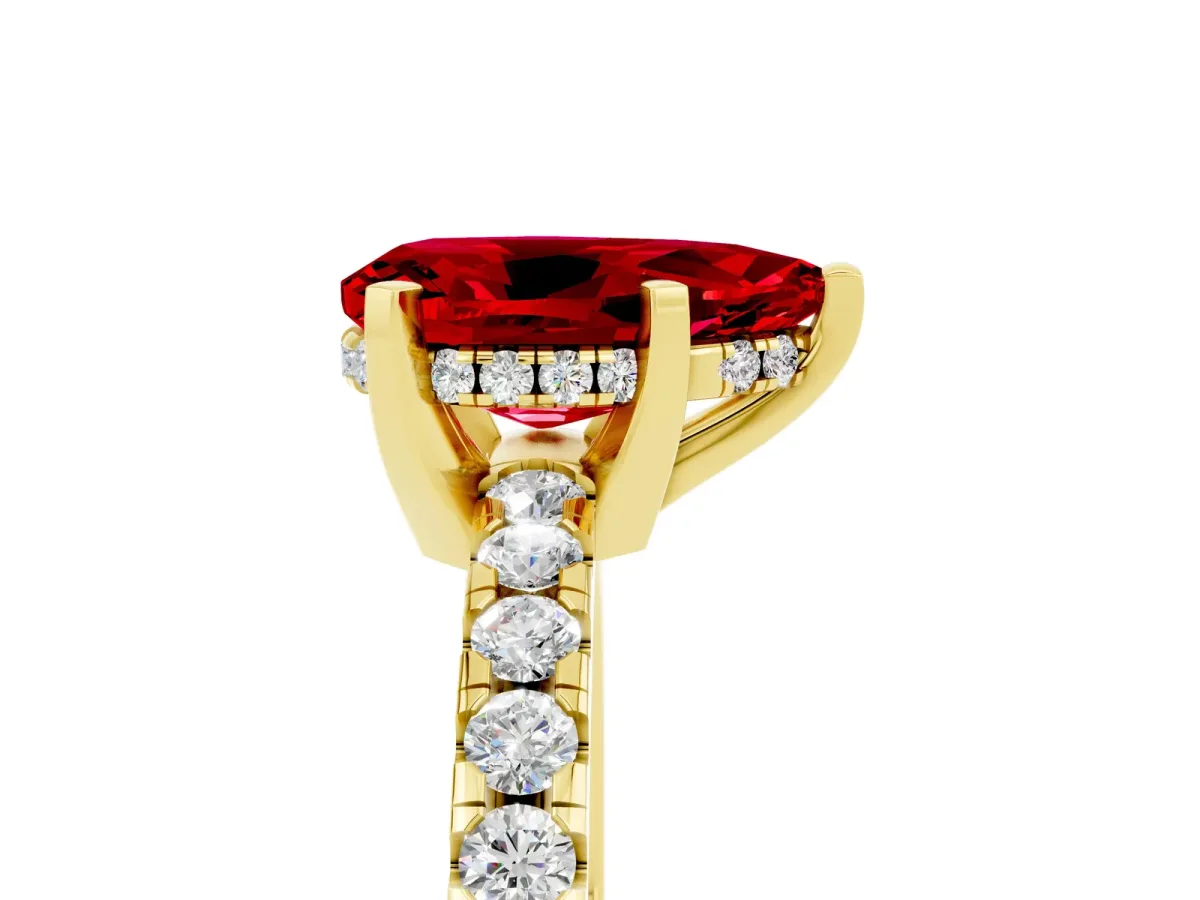 Pear Cut Ruby Solitaire Ring with Round Pavé Band and Four-Prong Setting Yellow gold