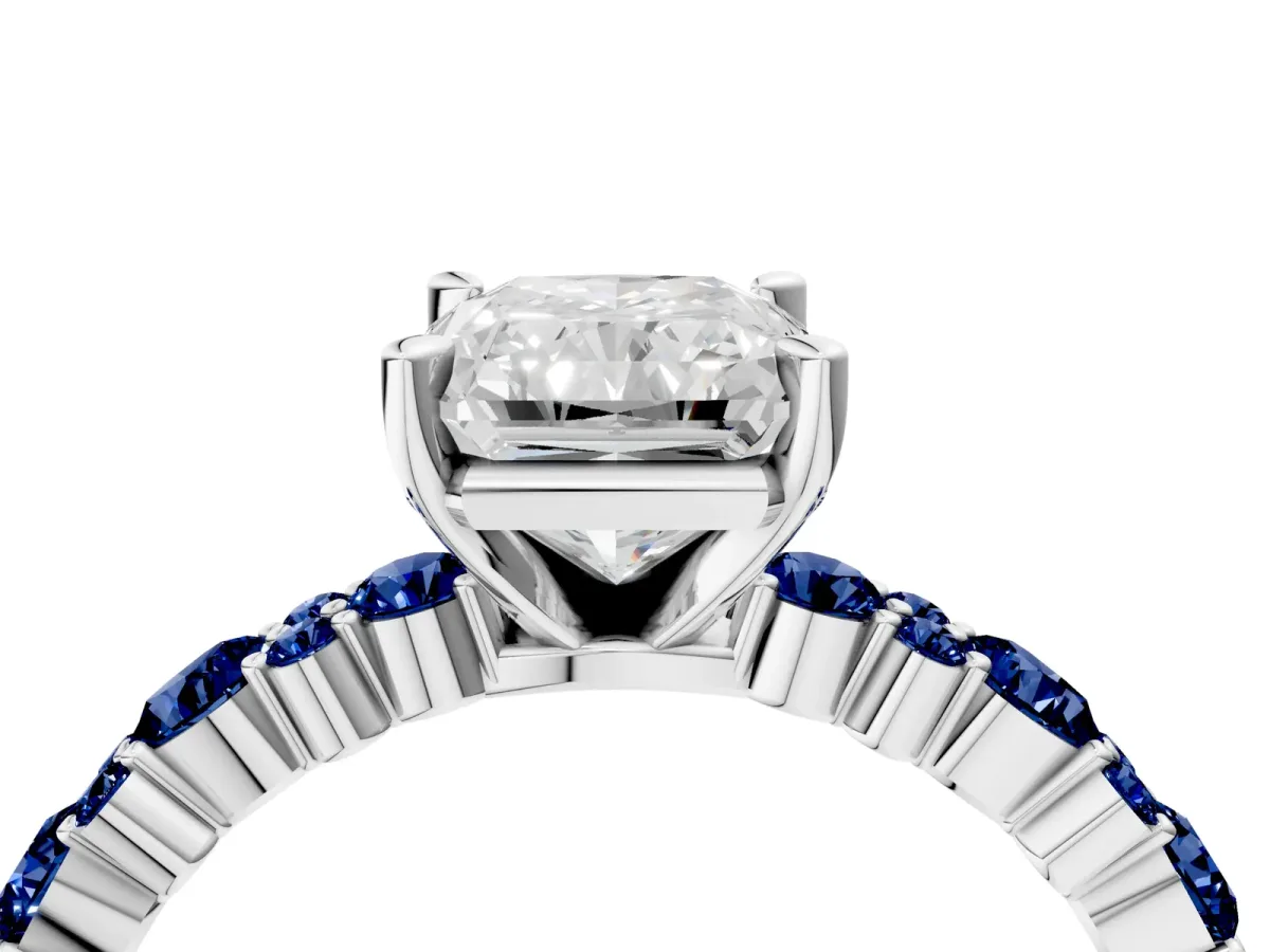 Radiant Cut Diamond Side Stone Solitaire Ring with Round Blue Sapphire and Four-Prong Setting Platinum