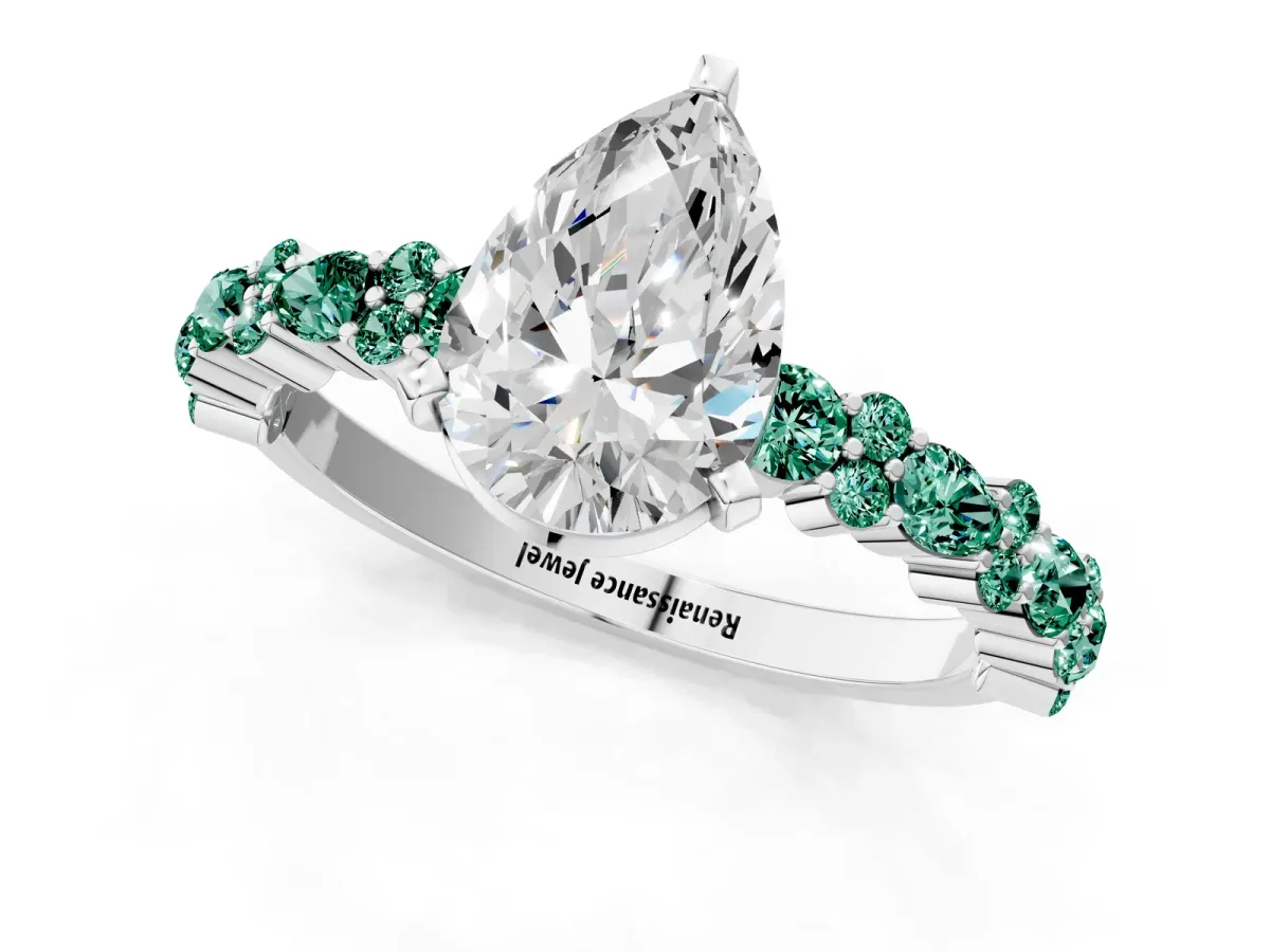 Pear Cut Diamond Side Stone Solitaire Ring with Round Green Sapphire and Four-Prong Setting Silver