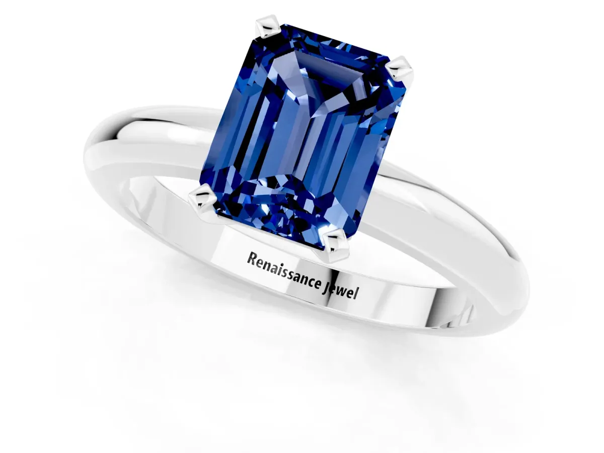 Emerald Cut Blue Sapphire Solitaire Engagement Ring with Round Band and Four-Prong Setting Silver