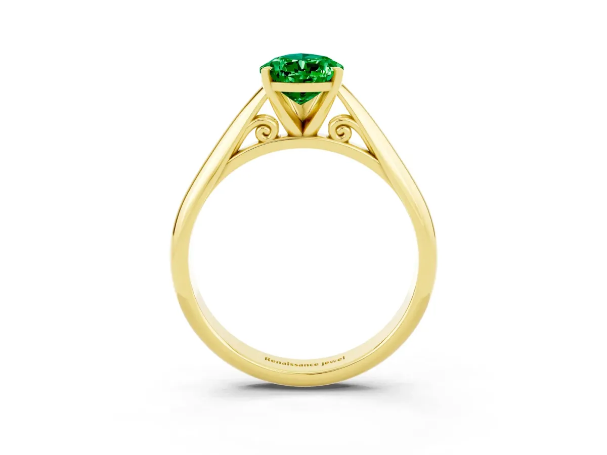 Pear Cut Emerald Solitaire Engagement Ring with Cathedral Setting and Four-Prong Mount Yellow gold