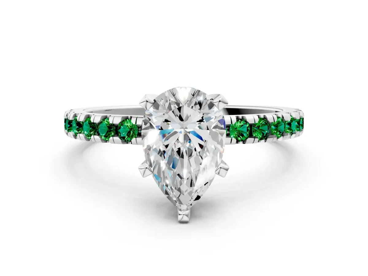 Pear Cut Diamond Solitaire Ring with Round Emerald Pavé Band and Four-Prong Setting Silver