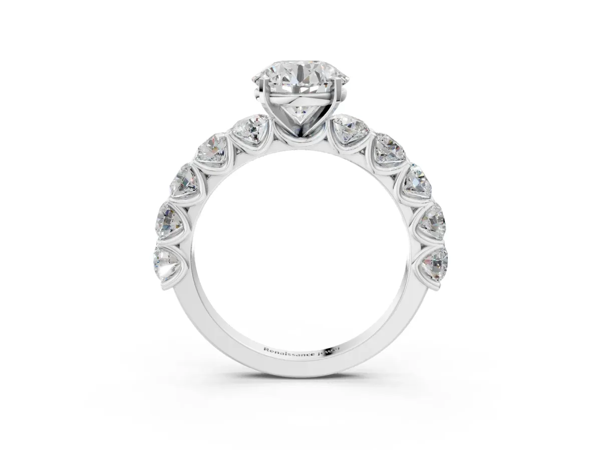 Round Cut Diamond Prong Setting with Side Stones on a Pave Band Platinum