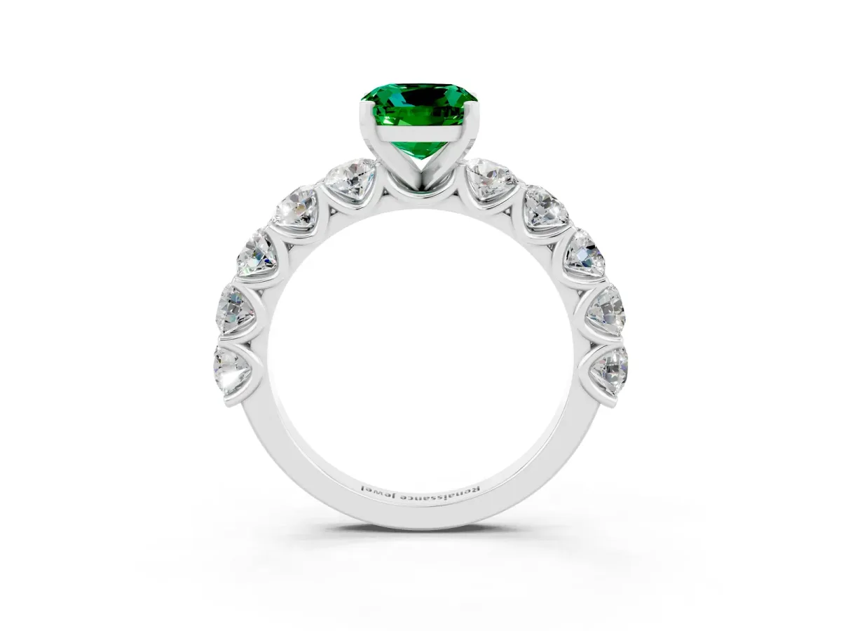 Cushion Cut Emerald Prong Setting with Side Stones on a Pave Band Platinum