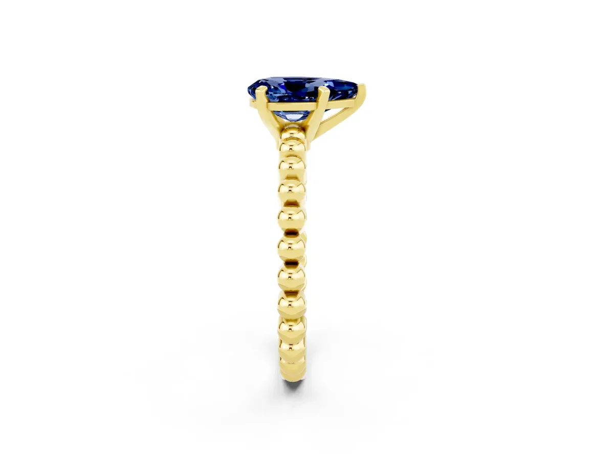 Pear Cut Blue Sapphire Solitaire Ring with Beaded Band and Prong Setting Yellow gold