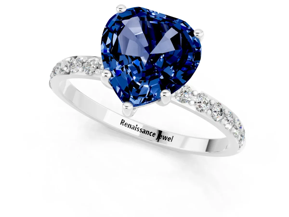 Heart Cut Blue Sapphire Solitaire Ring with Round Pavé Band and Prong Setting Silver