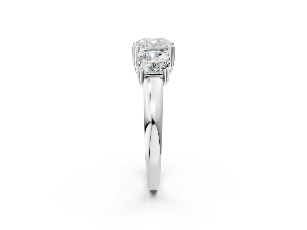 Three-Stone Cushion Cut Cut Diamond Ring with Channel Set Band and Four-Prong Setting White gold