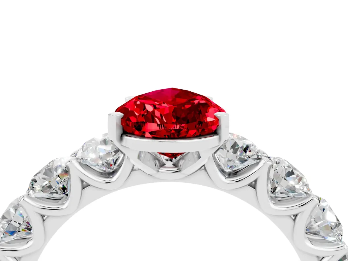 Pear Cut Ruby Prong Setting with Side Stones on a Pave Band Platinum