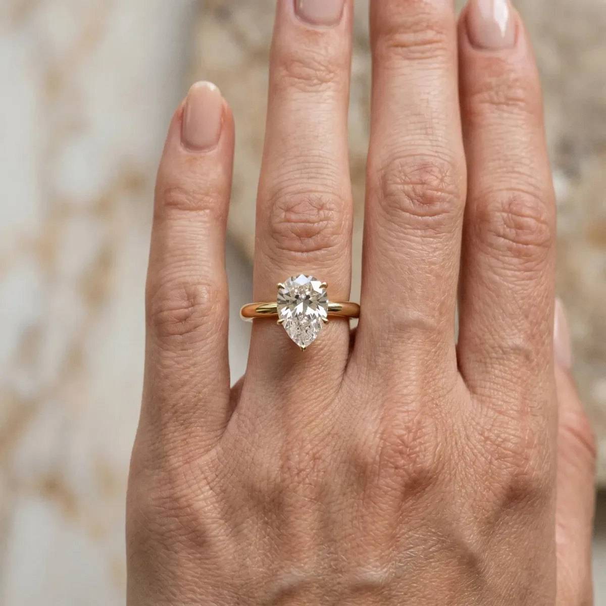 Pear Cut Diamond Solitaire Ring with Six-Prong Setting and Classic Band Yellow gold