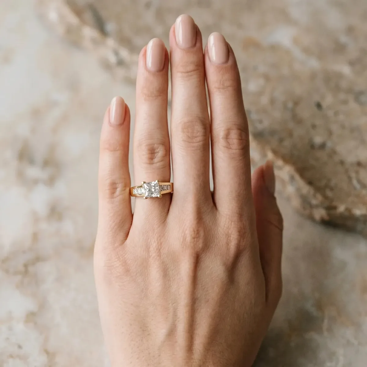 Radiant Cut Cut Channel Set Solitaire Ring with Four-Prong Setting Yellow gold