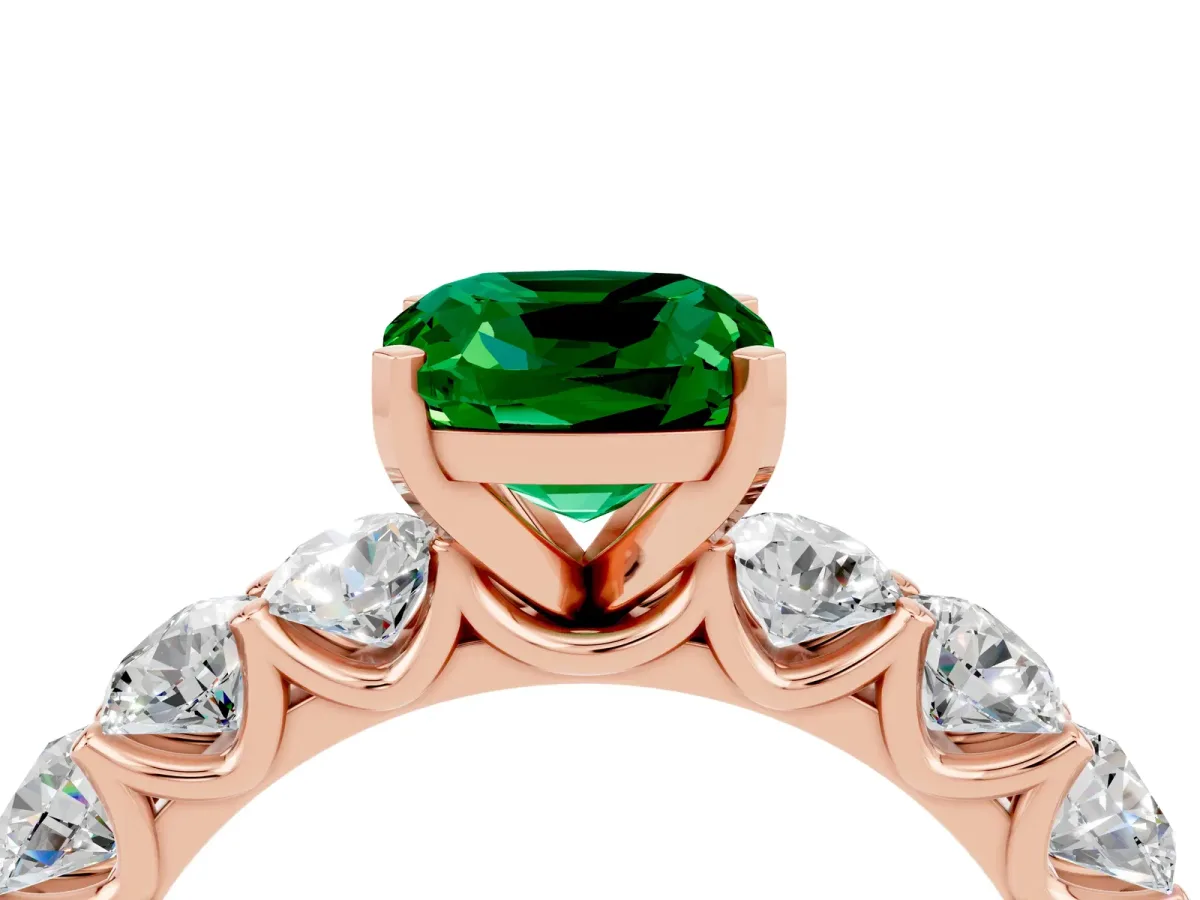 Cushion Cut Emerald Prong Setting with Side Stones on a Pave Band Rose gold