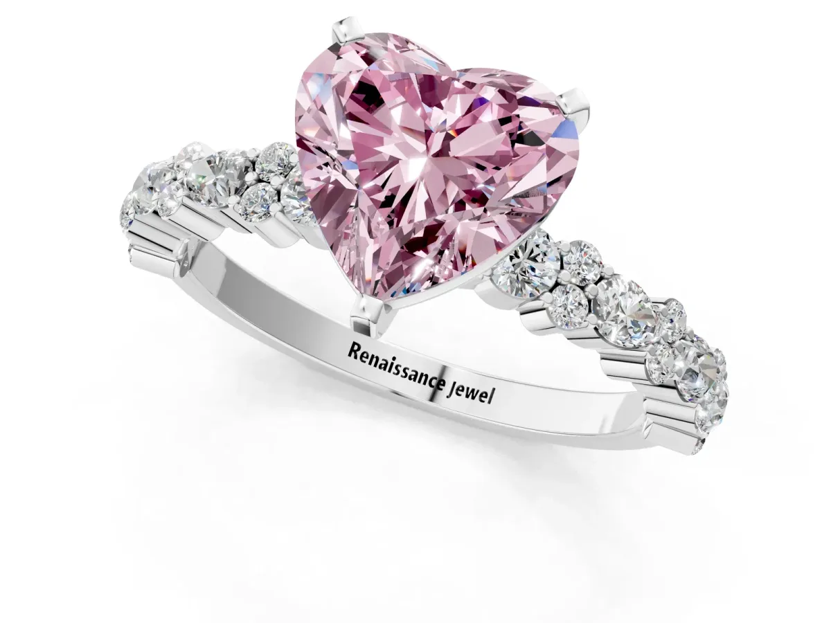 Fancy Pink Heart Cut Diamond Side Stone Solitaire Ring with Round and Four-Prong Setting Platinum